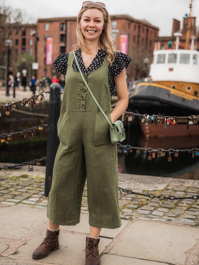 woman wearing linen dungarees and frill sleeve shirt